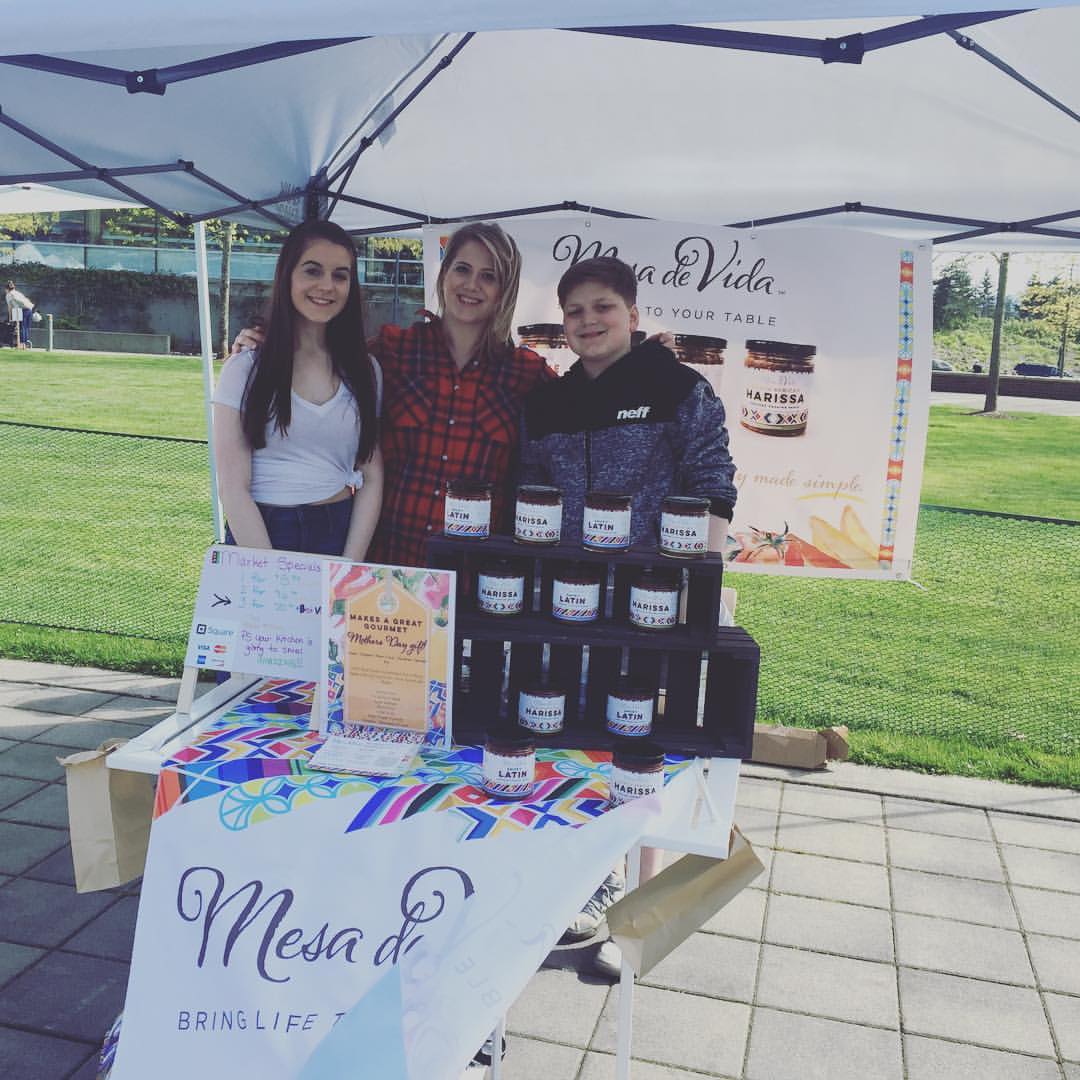 Chef Kirsten Sandoval and her kids at a farmer's market